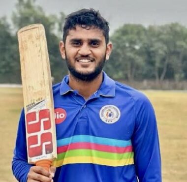 Urvil Patel posing after scoring a century for Gujarat