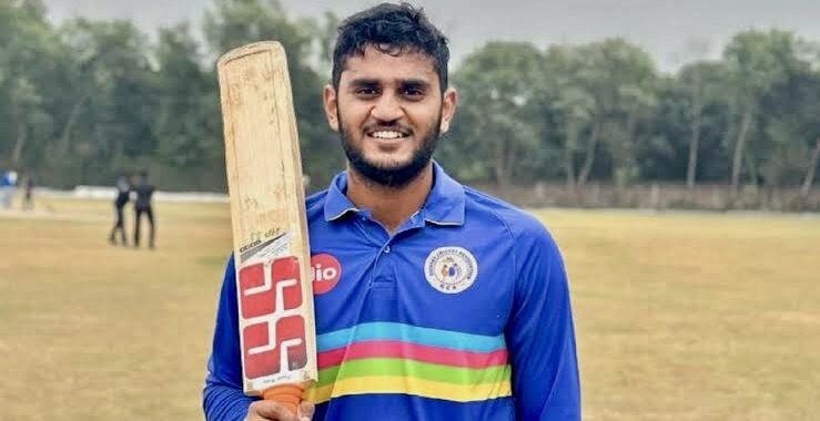 Urvil Patel posing after scoring a century for Gujarat