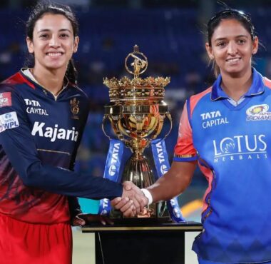India's Women's World Cup winners Smriti Mandhana and Harmanpreet Kaur posing with the WPL trophy during the WPL 2025 season