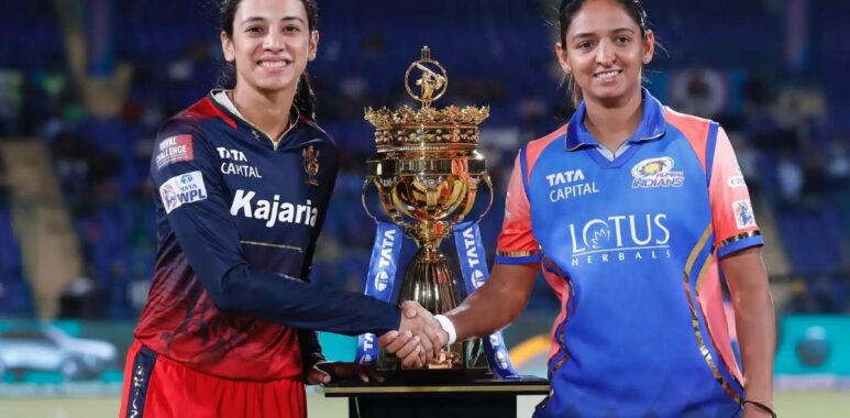 India's Women's World Cup winners Smriti Mandhana and Harmanpreet Kaur posing with the WPL trophy during the WPL 2025 season