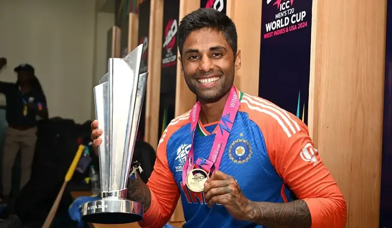 Suryakumar Yadav with the 2024 T20 World Cup trophy and winner's medal
